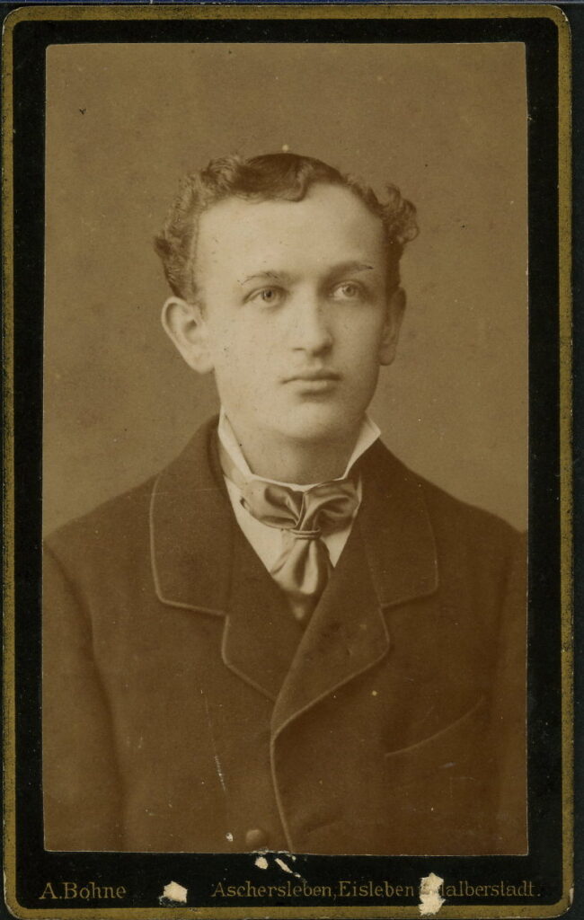 A monochrome photographic portrait from between 1865 and the 1920s taken by A. Bohne, Markt 25, Aschersleben, Breiter Weg 31, Halberstadt, Plan 15, Eisleben