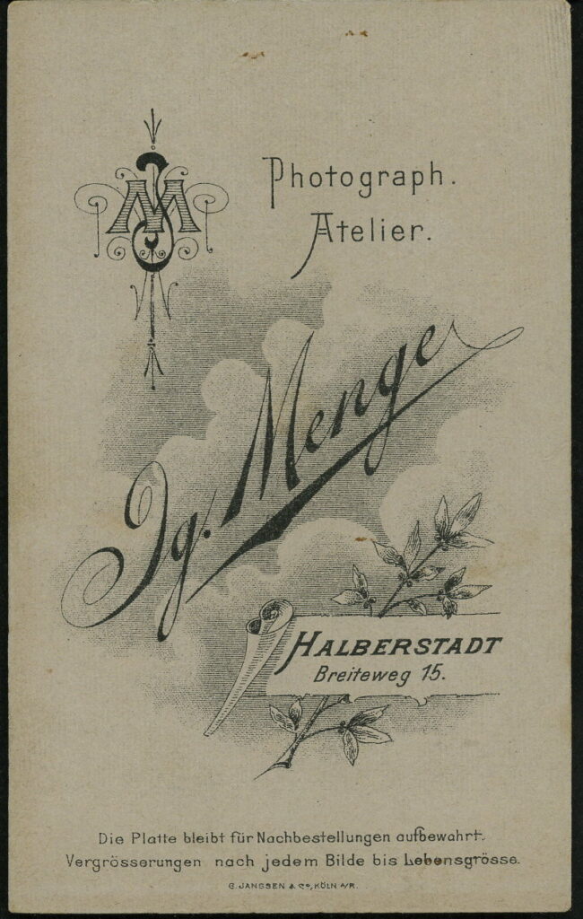 Reverse of a monochrome photographic portrait from between 1865 and the 1920s taken by Ig. Menge, Breiteweg 15, Halberstadt