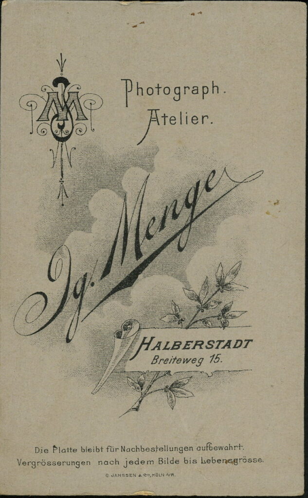 Reverse of a monochrome photographic portrait from between 1865 and the 1920s taken by Ig. Menge, Breiteweg 15, Halberstadt