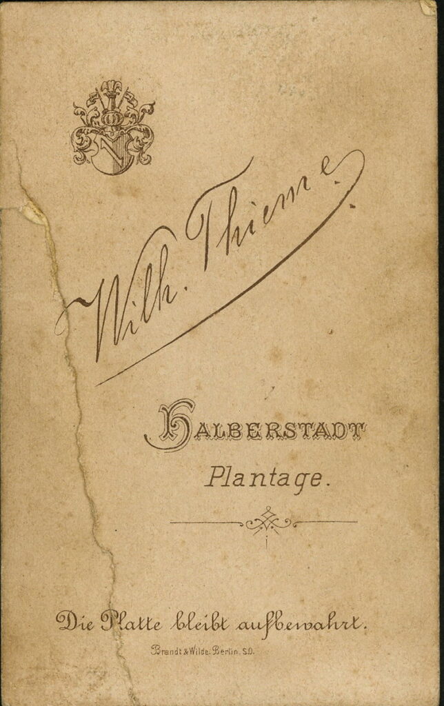 Reverse of a monochrome photographic portrait from between 1865 and the 1920s taken by Wilh. Thieme, Plantage, Halberstadt.