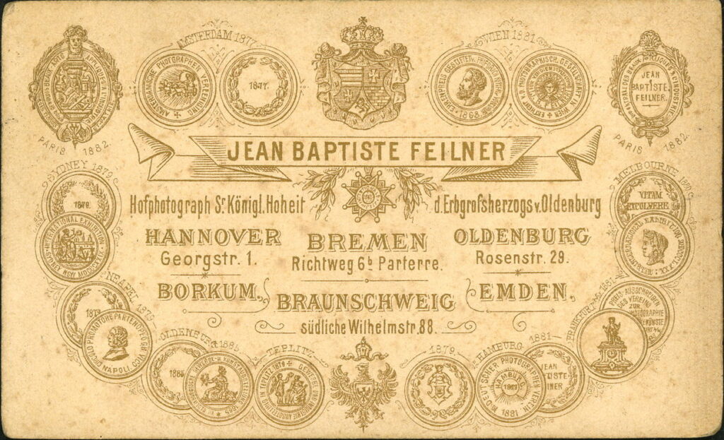 Reverse of a monochrome photographic portrait from between 1865 and the 1920s taken by Jean Baptiste Feilner, Georgstraße 1, Hannover and Richtweg 6, Bremen; Rosenstraße 21, Oldenburg; südl. Wilhelmstraße 88, Braunschweig; Emden; Borkum.