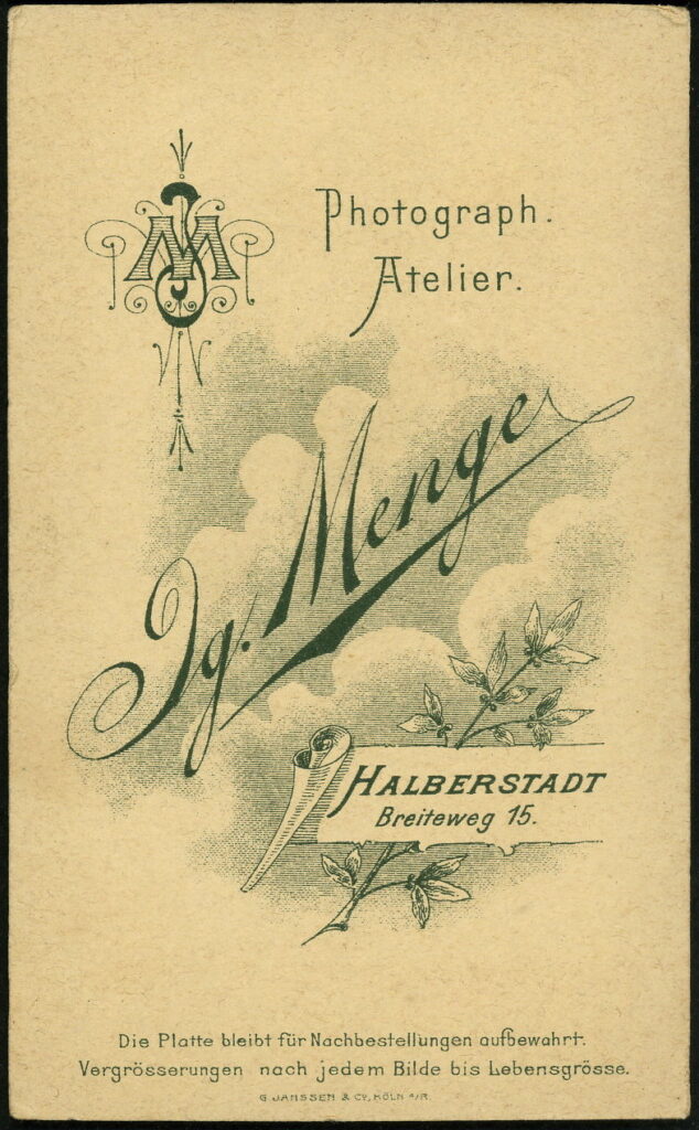 Reverse of a monochrome photographic portrait from between 1865 and the 1920s taken by Ig. Menge, Breiteweg 15, Halberstadt
