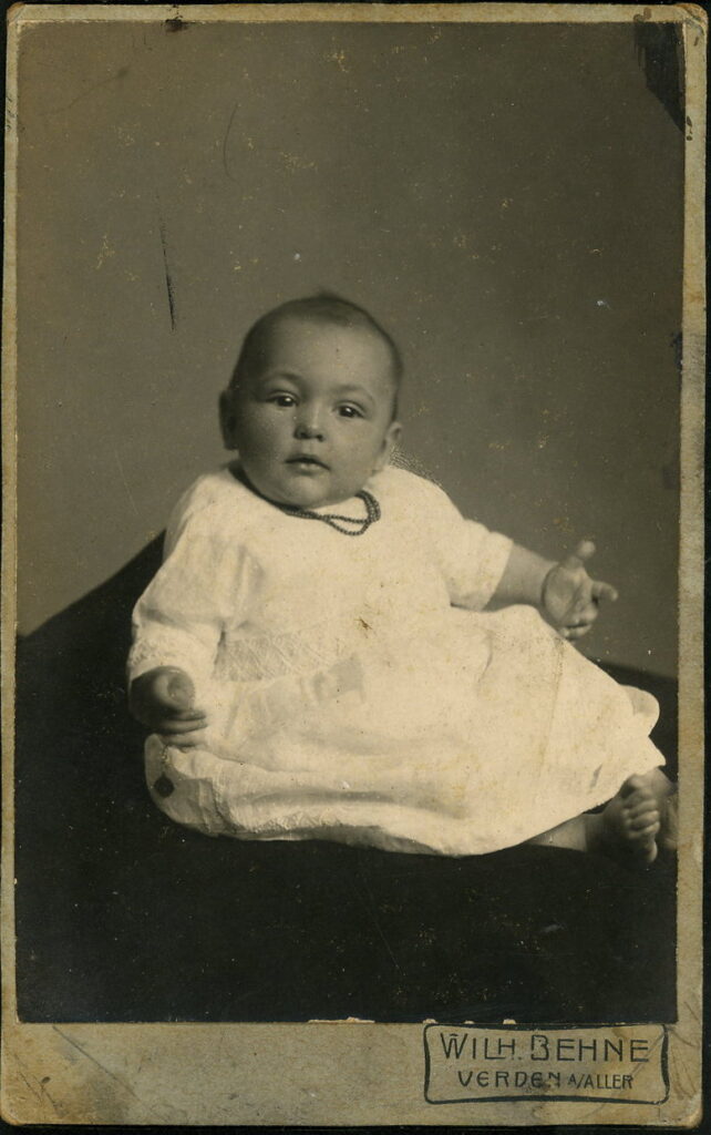 A monochrome photographic portrait from between 1865 and the 1920s taken by Wilh. Behne, Verden.