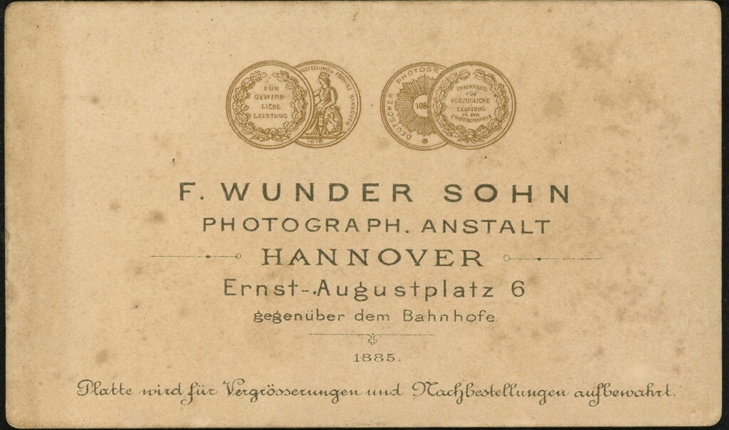 Reverse of a monochrome photographic portrait from between 1865 and the 1920s taken by F. Wunder Sohn, Ernst-Augustplatrz 6, Hannover in 1885