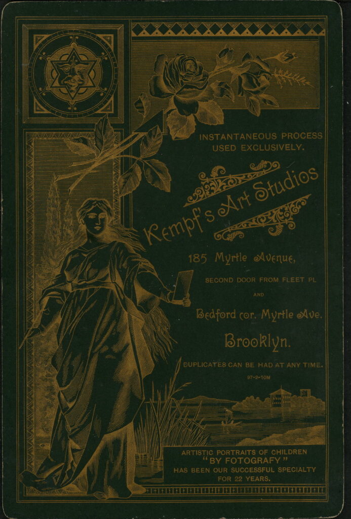 Reverse of a monochrome photographic portrait from between 1865 and the 1920s taken in Kempf's Art Studios, 185 Myrtle Avenue, Brooklyn, NY