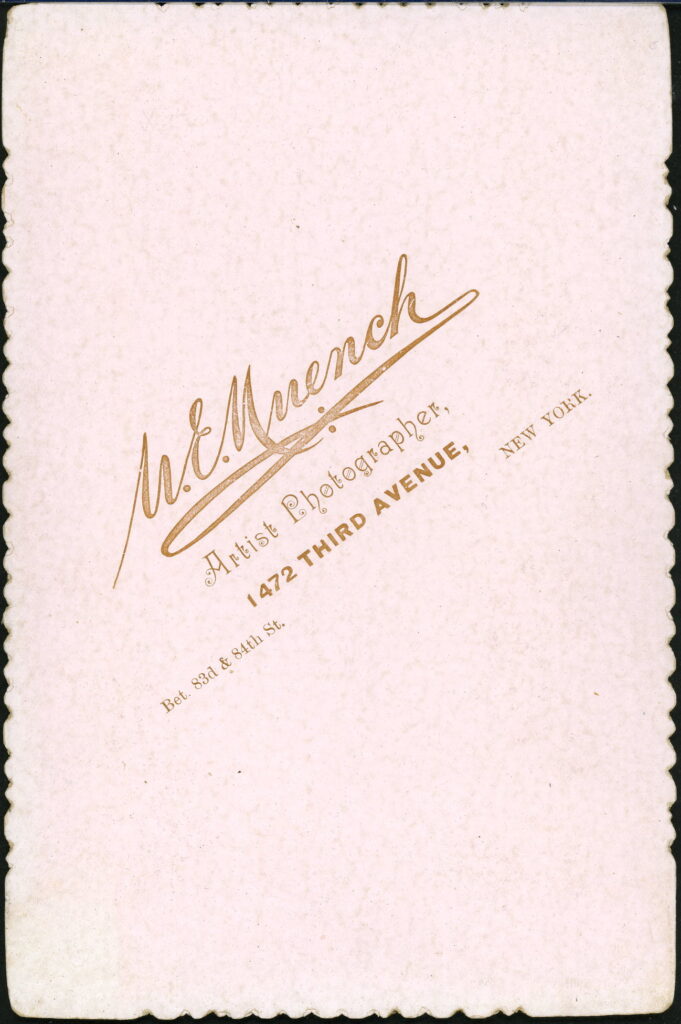 Reverse of a monochrome photographic portrait from between 1865 and the 1920s taken by U. E. Muench, 1472 Third Avenue, New York