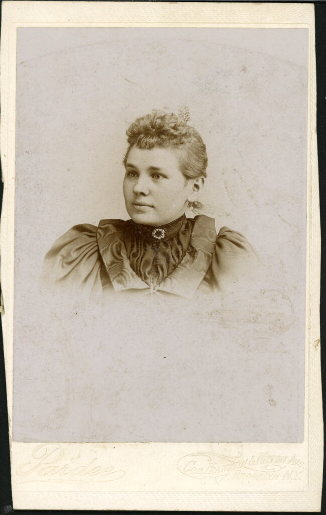 A monochrome photographic portrait from between 1865 and the 1920s taken by Pardee, Corner Franklin and Fulton Avenues, Brooklyn, NY