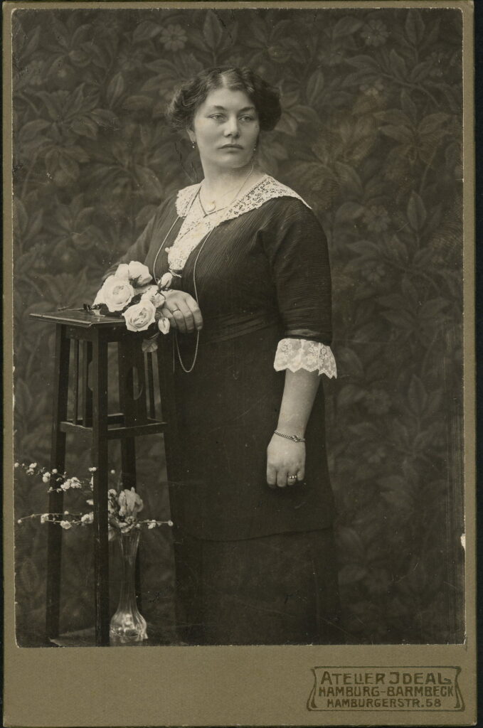 A monochrome photographic portrait from between 1865 and the 1920s taken in Atelier Ideal, Hamburgerstraße 58, Hamburg-Barmbeck