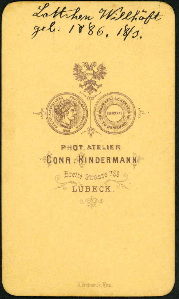 Reverse of a monochrome photographic portrait from between 1865 and the 1920s taken by Conr. Kindermann, Breite Straße 788, Lübeck dated 1886