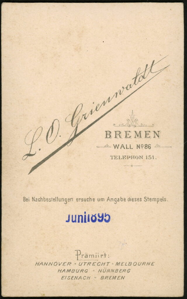 Reverse of a monochrome photographic portrait from between 1865 and the 1920s taken by L. O. Grienwaldt, Wall 86, Bremen, dated 1895
