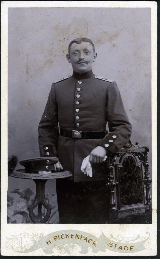 A monochrome photographic portrait from between 1865 and the 1920s taken by H. Pickenpack, Ecke Höker- und kl. Schmiedestraße, Stade