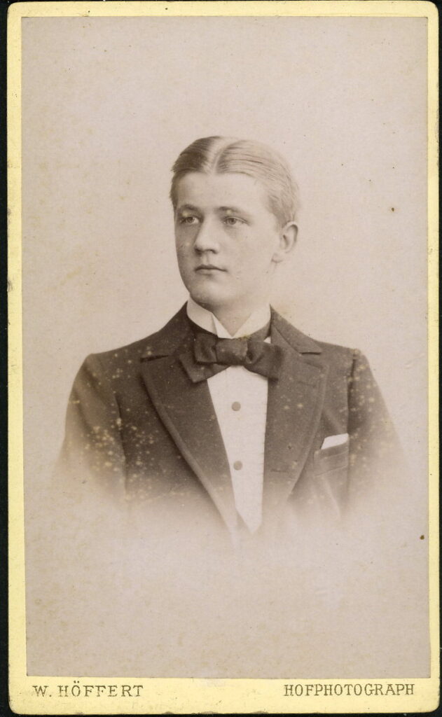 A monochrome photographic portrait from between 1865 and the 1920s taken by W. Höffert, Prager-Straße 6, Dresden, Petersbrücke, Leipzig, Tauentzienplatz 11, Breslau, Jungfernstieg 12, Hannover, Breiteweg 196-197, Magdeburg, Georg-straße 14, Hannover, Leipziger Platz 12, Berlin, Unter den Linden 24, Berlin