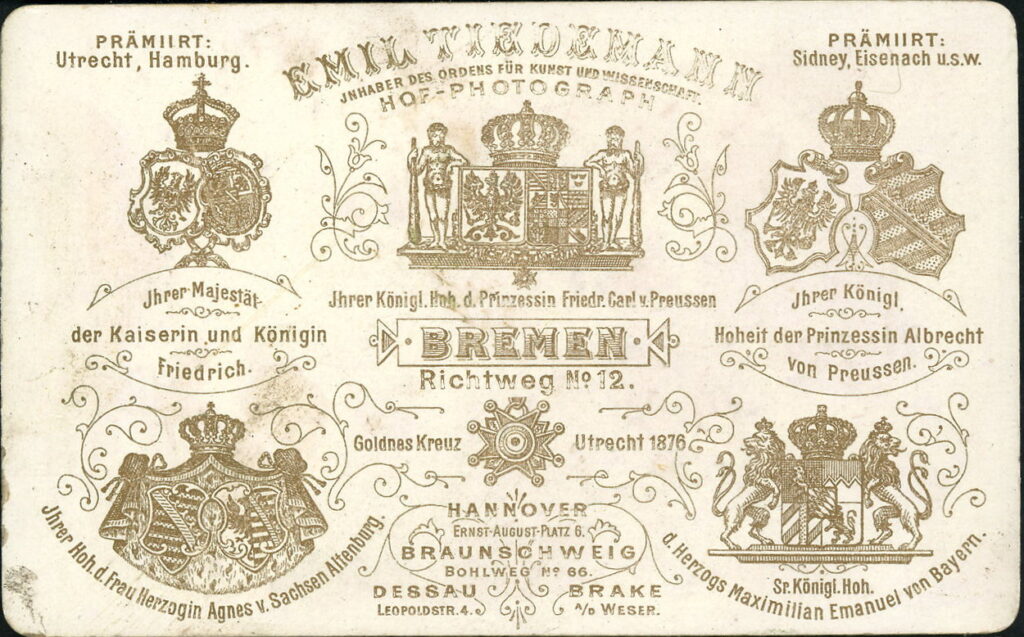 Reverse of a monochrome photographic portrait from between 1865 and the 1920s taken by Emil Tiedemann, Richtweg 12, Bremen, Ernst-August-Platz 6, Hannover, Bohlweg 66, Braunschweig, Leopoldstraße 4, Dessau, Brake a. W.