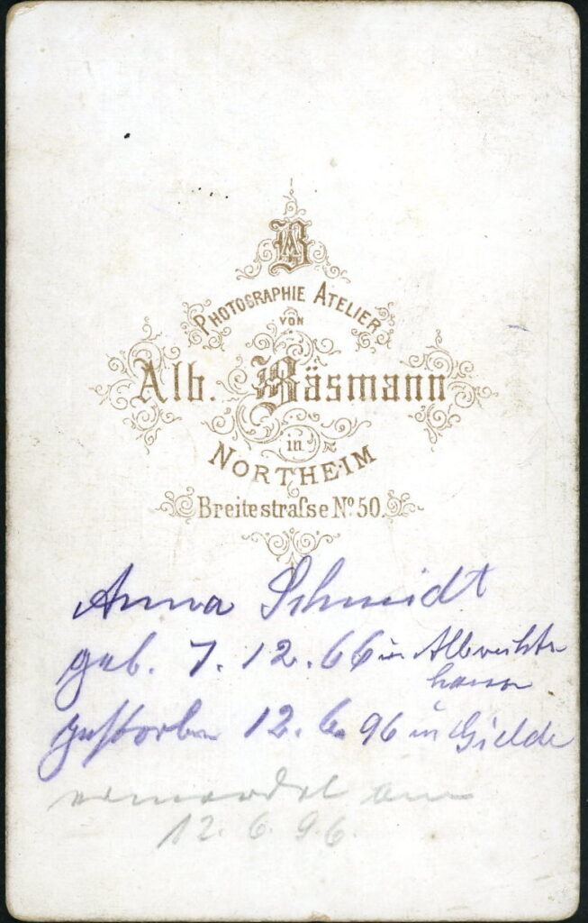 Reverse of a monochrome photographic portrait from between 1865 and the 1920s taken by Alb. Bäsmann, Breitestraße 50, Northeim