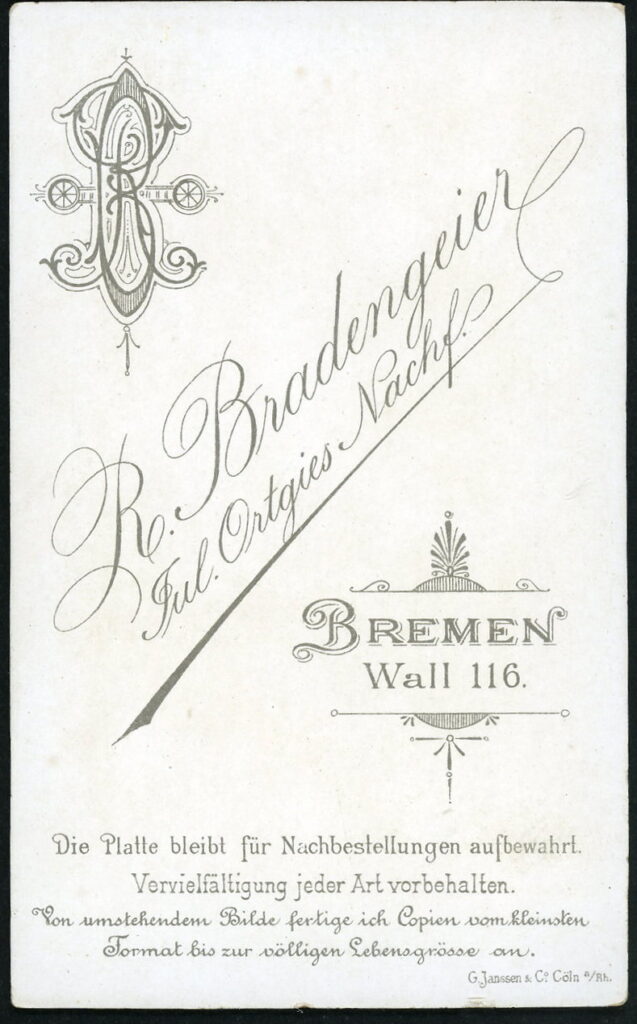 Reverse of a monochrome photographic portrait from between 1865 and the 1920s taken by R. Bradengeier, formerly Jul. Ortgies, Wall 116, Bremen