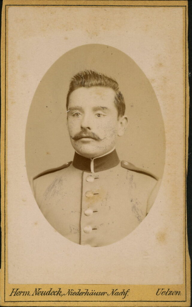 A monochrome photographic portrait from between 1865 and the 1920s taken by Herm. Neudeck, formerly Niederhäuser, Gudesstraße 180, Uelzen