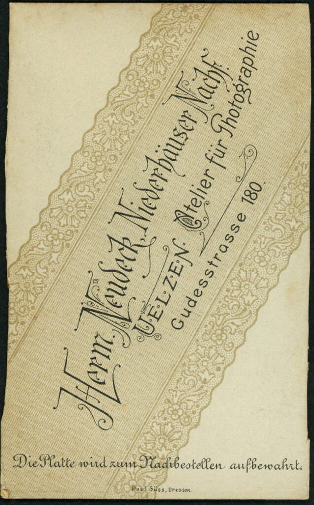 Reverse of a monochrome photographic portrait from between 1865 and the 1920s taken by Herm. Neudeck, formerly Niederhäuser, Gudesstraße 180, Uelzen
