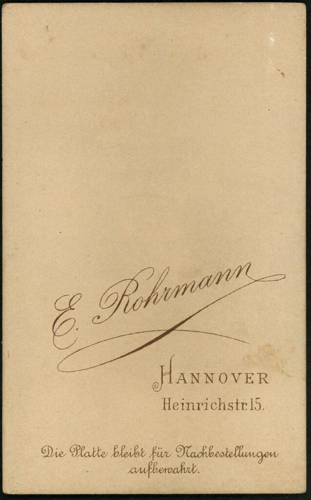 Reverse of a monochrome photographic portrait from between 1865 and the 1920s taken by E. Rohrmann, Heinrichstraße 15, Hannover