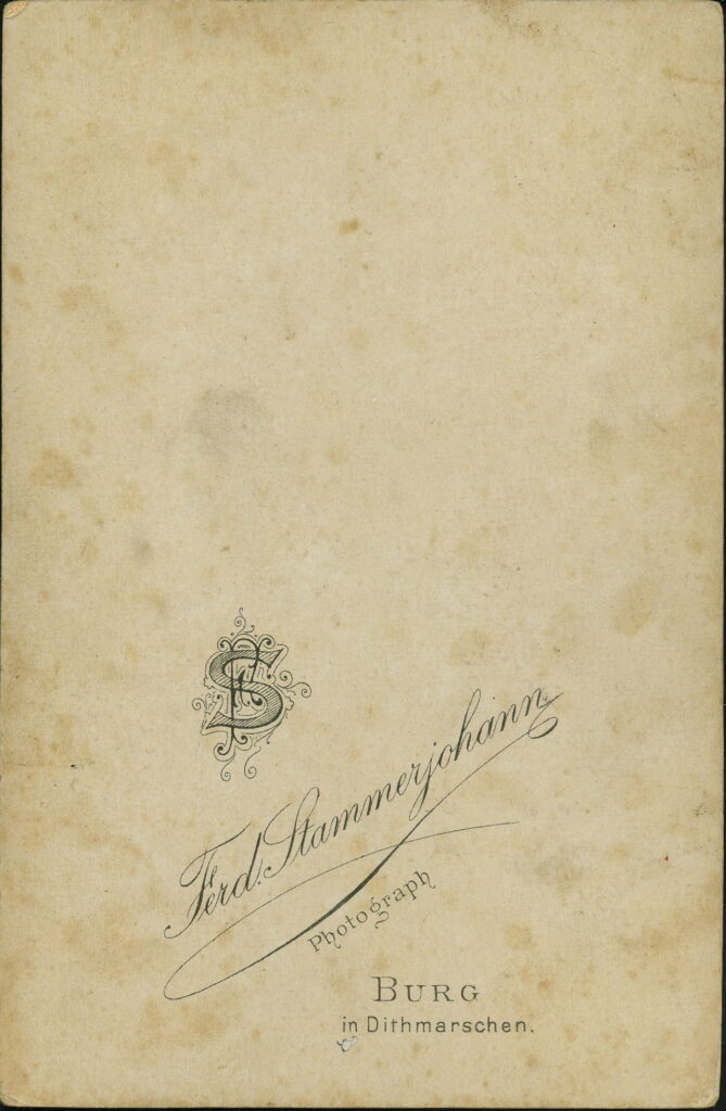 Reverse of a monochrome photographic portrait from between 1865 and the 1920s taken by Ferd. Stammerjohann, Burg in Dithmarschen
