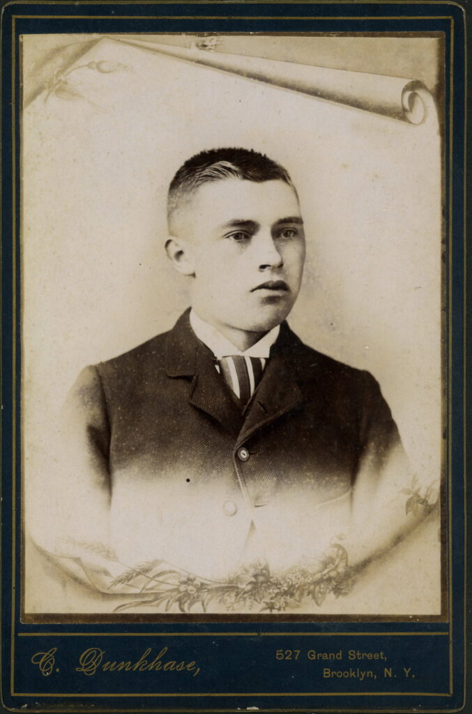 A monochrome photographic portrait from between 1865 and the 1920s taken by C. Dunkhase, 527 Grand Street, Brooklyn E.D.