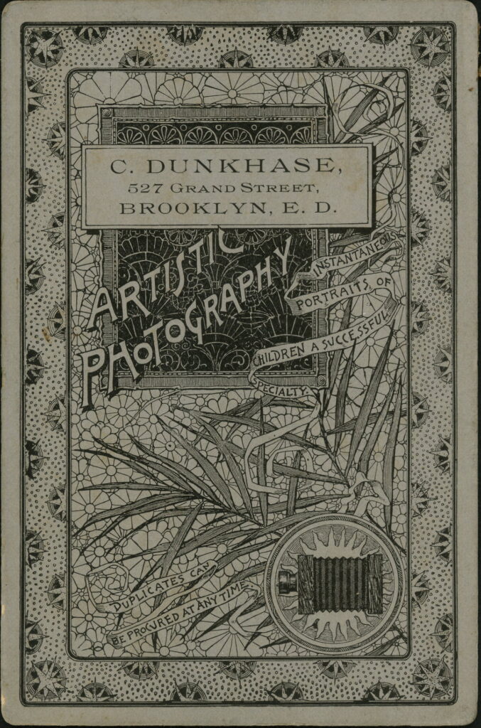 Reverse of a monochrome photographic portrait from between 1865 and the 1920s taken by C. Dunkhase, 527 Grand Street, Brooklyn E.D.