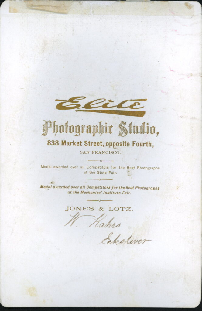 Reverse of a monochrome photographic portrait from between 1865 and the 1920s taken in Elite Studio, 838 Market Street, San Francisco