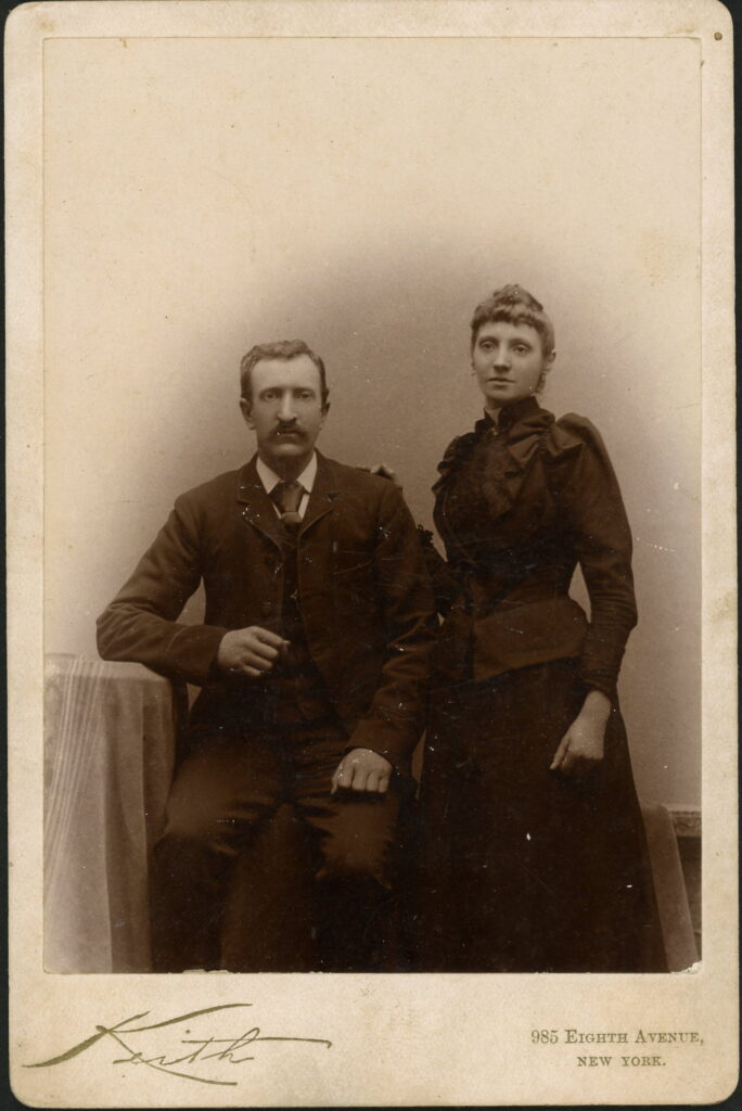 A monochrome photographic portrait from between 1865 and the 1920s taken in Atelier Keith, 985 Eighth Avenue, New York