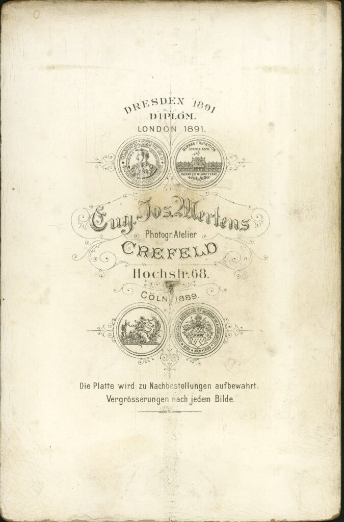 Reverse of a monochrome photographic portrait from between 1865 and the 1920s taken by Eug. Jos. Mertens, Hochstraße 68, Crefeld