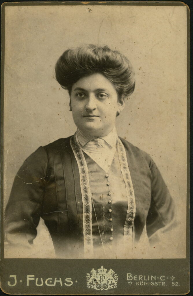 A monochrome photographic portrait from between 1865 and the 1920s taken by J. Fuchs, Friedrichstraße 108, Berlin, Friedrichstraße 138, Berlin, Königstraße 52, Berlin, Wilmersdorferstraße 57, Charlottenberg, Köln, Dresden and Breslau.