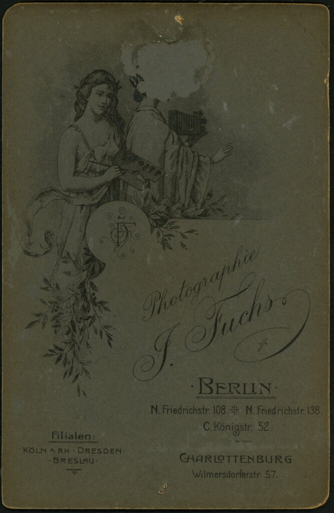 Reverse of a monochrome photographic portrait from between 1865 and the 1920s taken by J. Fuchs, Friedrichstraße 108, Berlin, Friedrichstraße 138, Berlin, Königstraße 52, Berlin, Wilmersdorferstraße 57, Charlottenberg, Köln, Dresden and Breslau.