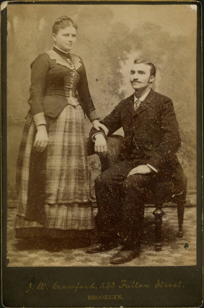 A monochrome photographic portrait from between 1865 and the 1920s taken by J. W. Crawford, 543 Fulton Street, Brooklyn