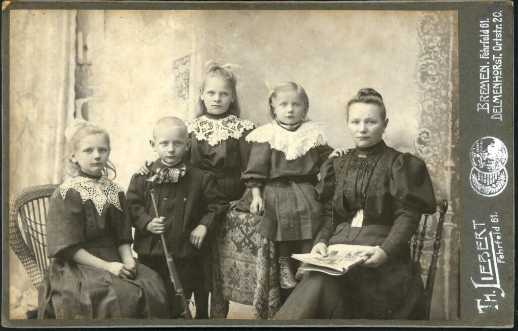 A monochrome photographic portrait from between 1865 and the 1920s taken by Th. Liebert, Fehrfeld 61, Bremen; Ortstraße 20, Delmenhorst