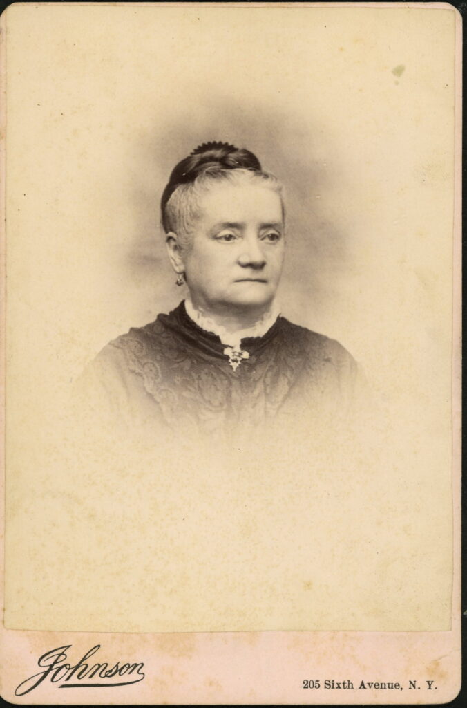 A monochrome photographic portrait from between 1865 and the 1920s taken by Johnson, 205 Sixth Avenue, NY