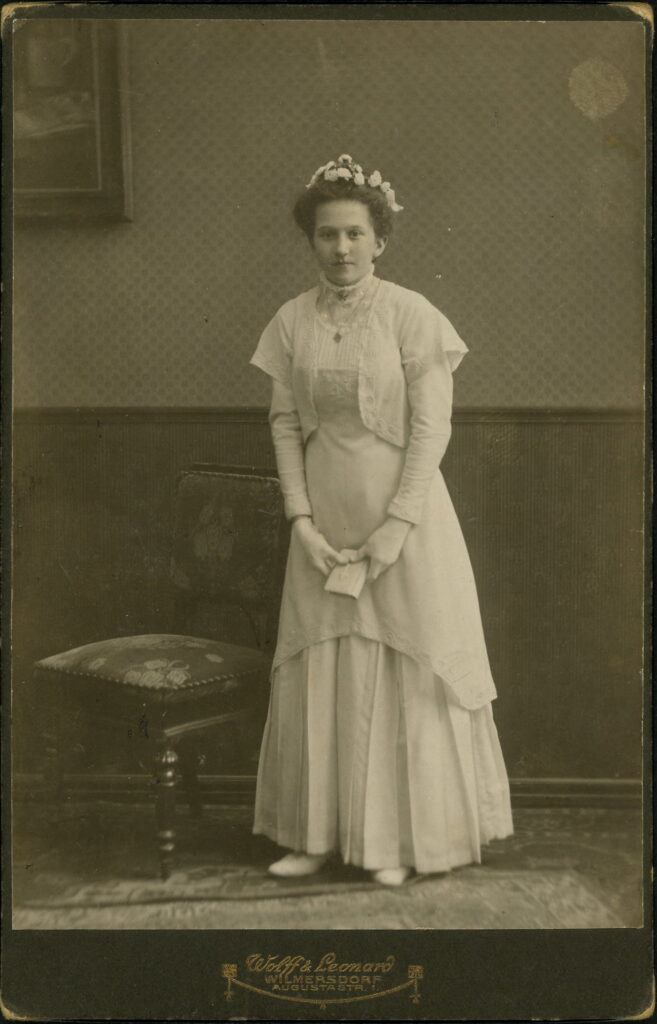 A monochrome photographic portrait from between 1865 and the 1920s taken by Wolff & Leonard, Augustastraße 1, Wilmersdorf, and dated 1910