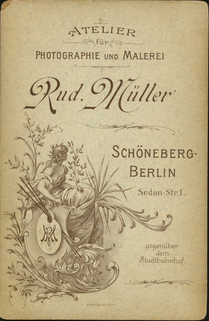 Reverse of a monochrome photographic portrait from between 1865 and the 1920s taken by Rud. Müller, Sedan-Straße 1, Schöneberg-Berlin