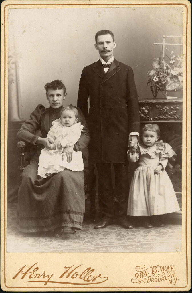 A monochrome photographic portrait from between 1865 and the 1920s taken by Henry Holler, 984 Broadway, Brooklyn, NY