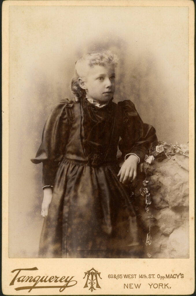 A monochrome photographic portrait from between 1865 and the 1920s taken in Tanquerey Studio, 63 / 65 West 14th Street, New York and 6th Avenue, New York