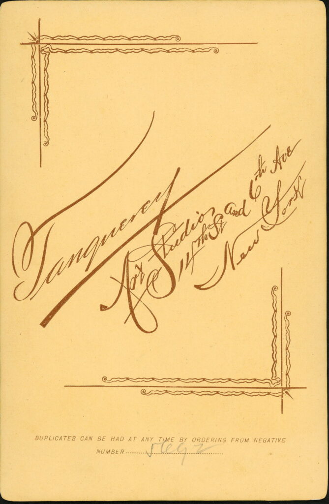 Reverse of a monochrome photographic portrait from between 1865 and the 1920s taken in Tanquerey Studio, 63 / 65 West 14th Street, New York and 6th Avenue, New York