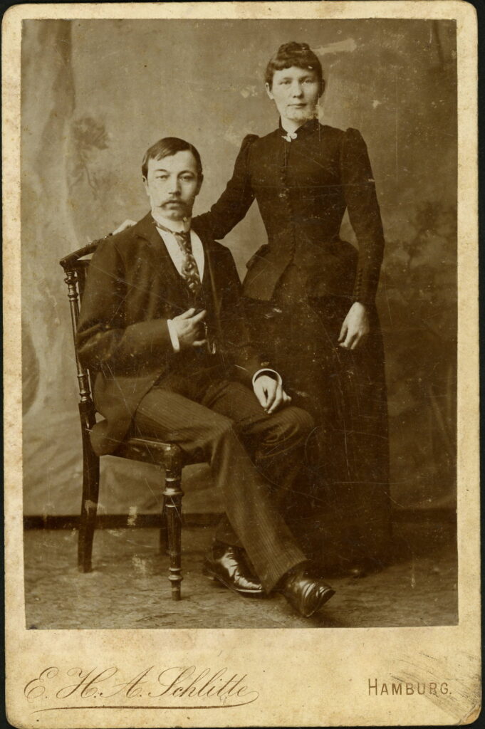 A monochrome photographic portrait from between 1865 and the 1920s taken by E. H. A. Schlitte, Gr. Johannisstraße 4, Hamburg