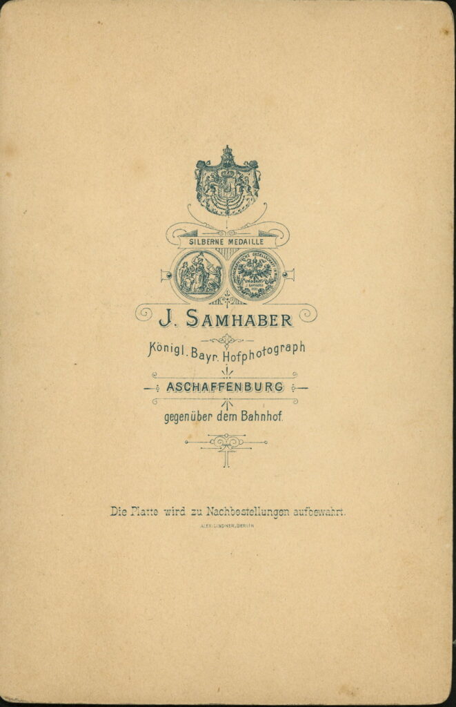Reverse of a monochrome photographic portrait from between 1865 and the 1920s taken by J. Samhaber, Aschaffenburg