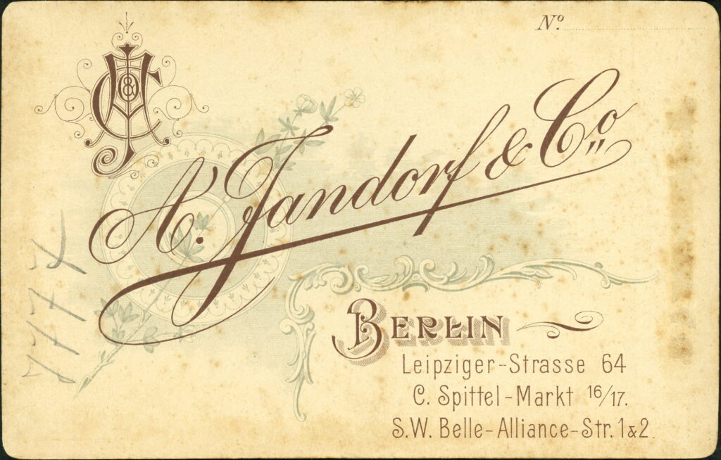 Reverse of a monochrome photographic portrait from between 1865 and the 1920s taken by A. Jandorf, Leipziger-Straße 64, Berlin, Spittel-Markt 16 / 17, Berlin and Belle-Alliance-Straße 1 & 2, Berlin