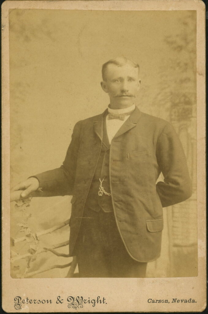 A monochrome photographic portrait from between 1865 and the 1920s taken by Peterson & Wright, Carson, Nevada