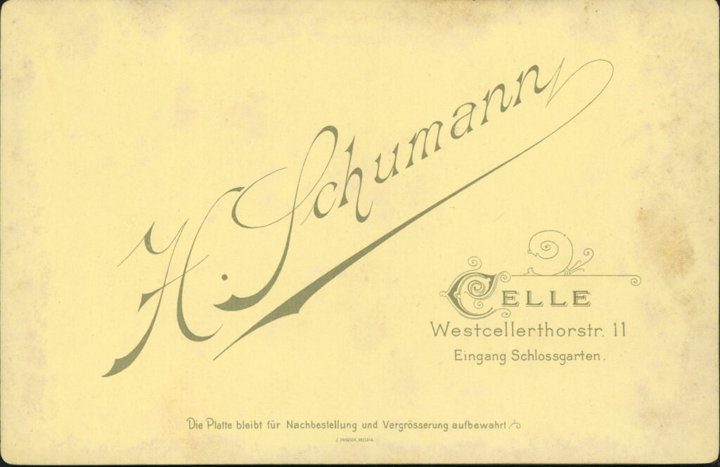 Reverse of a monochrome photographic portrait from between 1865 and the 1920s taken by H. Schuhmann, Westcellerthorstraße 11, Celle.